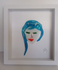 abstract female face with blue hair and red lipstick in glass picture frame